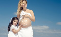 Making a smile on mom's belly